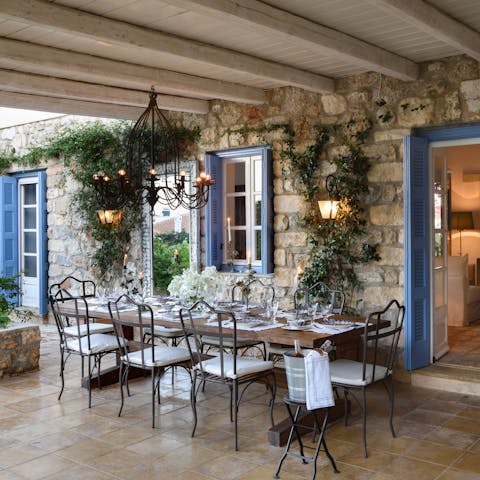 Feel the warm Grecian breeze as you dine alfresco on the terrace