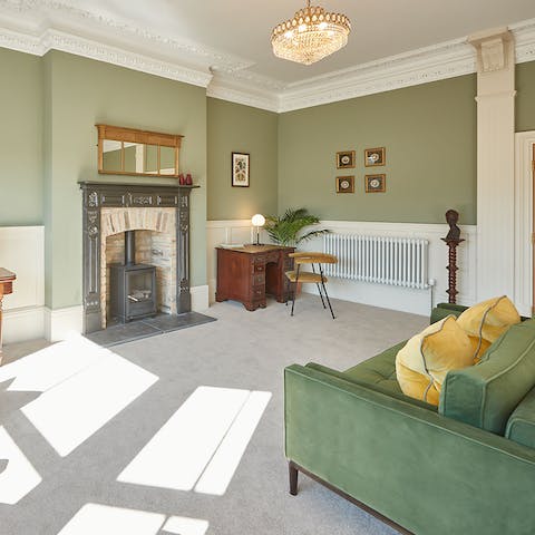 Get cosy by stoking the fire in the wood-burning stove