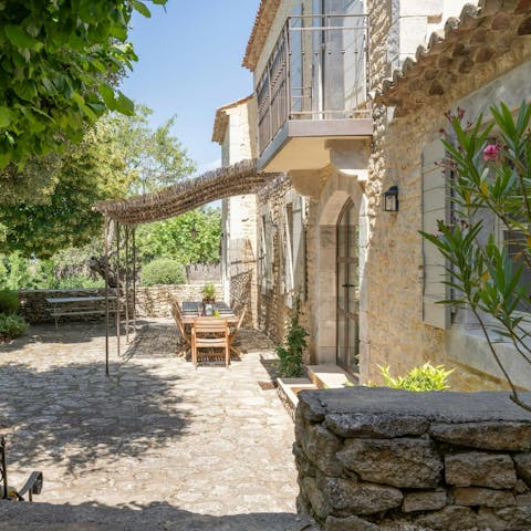 Share a bottle of rosé on the pretty terrace