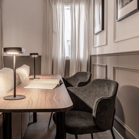 Catch up on work emails at the desk in the living room