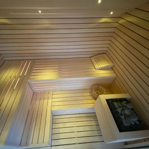 Soothe your muscles in the private dry sauna