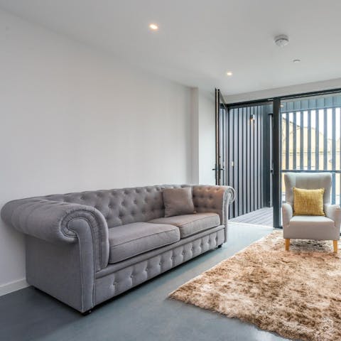 Kick back and relax in the light-filled living space courtesy of floor-to-ceiling windows