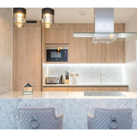 Sip on your morning coffee at the marble-topped breakfast bar or keep your loved ones company while cooking