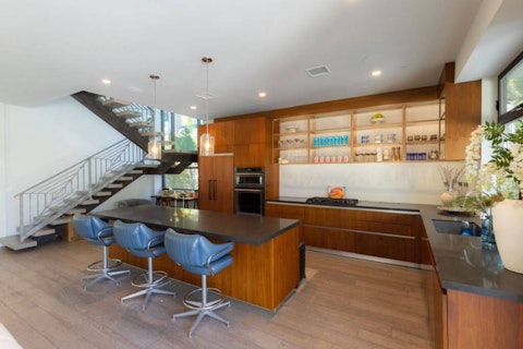 Cook and gather in a mid-century kitchen that flows seamlessly into the lounge