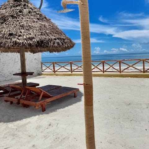 Lounge on the sun beds to catch a tan while sipping cocktails