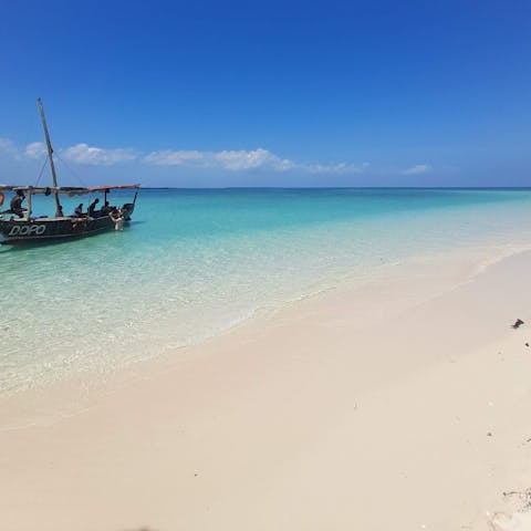 Walk out onto the gorgeous white sand of the beach right on your doorstep