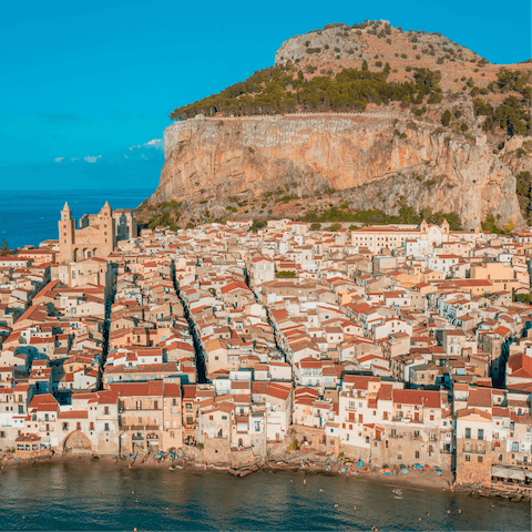 Explore the coastal-grazing city of Cefalù, a twelve-minute drive away