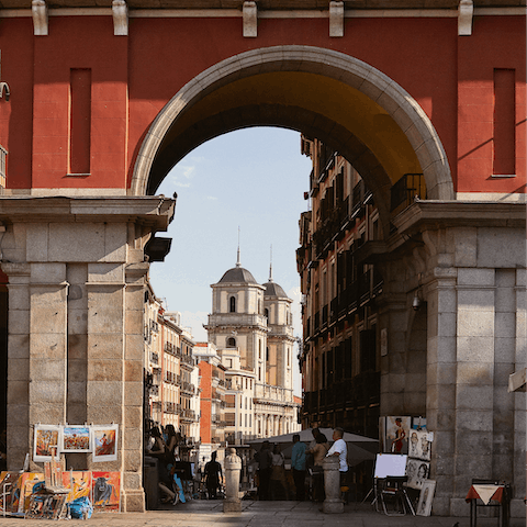 Marvel at Plaza Mayor, a fourteen-minute walk away
