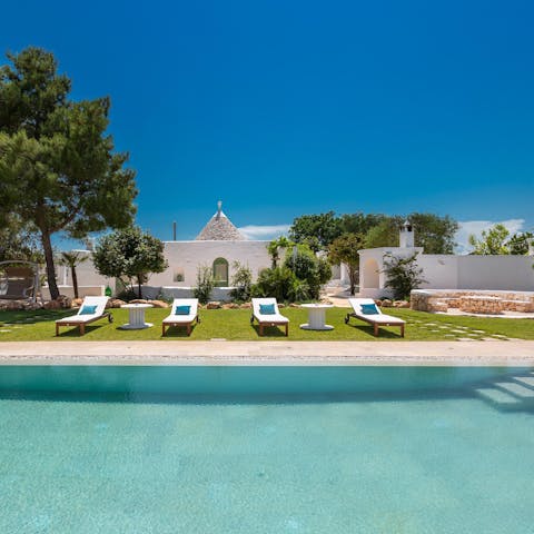 Choose instead to swim in the home's large pool before drying off on a lounger