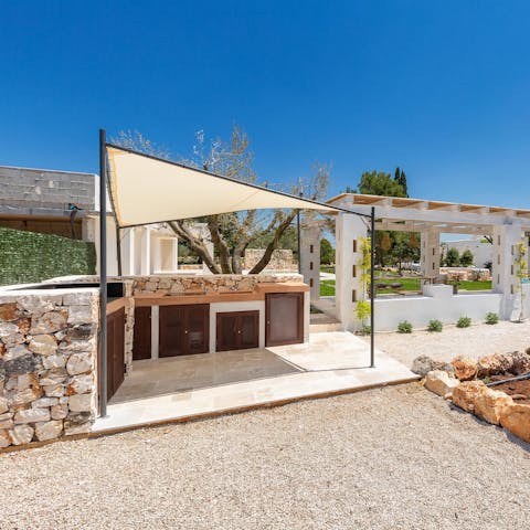 Try your hand at the local cuisine in the shady outdoor kitchen