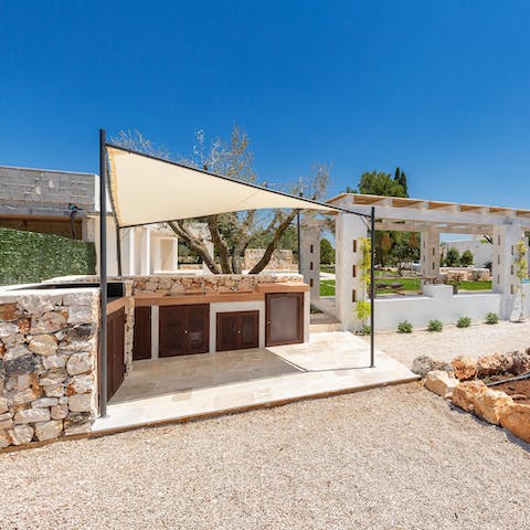 Try your hand at the local cuisine in the shady outdoor kitchen