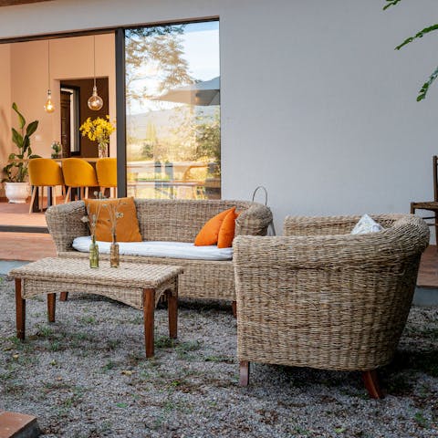 Relax on the outdoor sofas with a glass of local wine