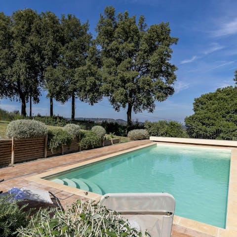 Spend the afternoon unwinding by the private pool