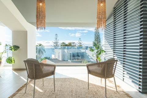 Enjoy a quiet moment with drinks on the upstairs balcony