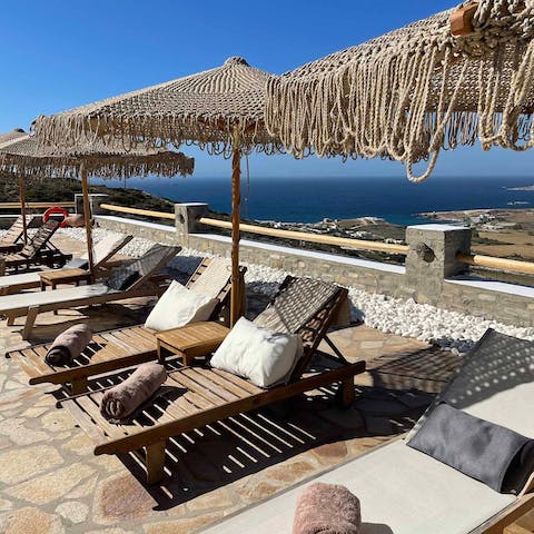 Grab a sunlounger and chill by the pool