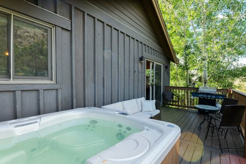 Ease into the hot tub among the trees after the slopes