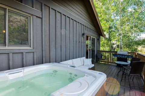Ease into the hot tub among the trees after the slopes