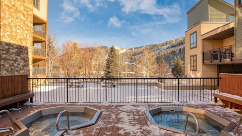 Soak in the community hot tub and enjoy the mountain views