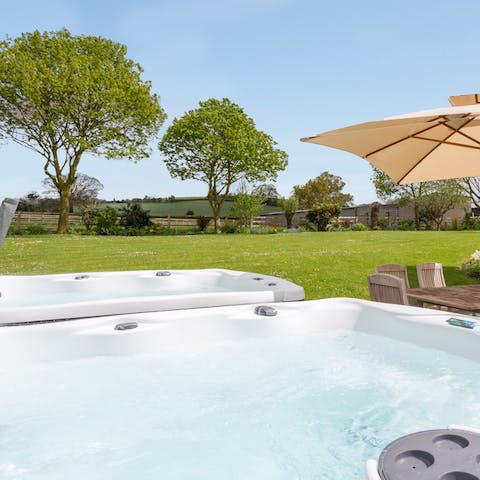 Soak in one of the two hot tubs