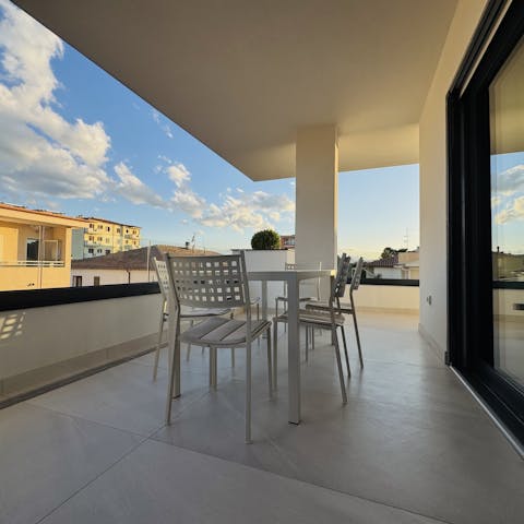 Relax with a drink on your private balcony