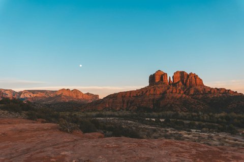 Photograph Cathedral Rock's iconic red sandstone buttes reflected in Oak Creek, a fifteen-minute drive