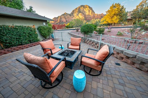 Toast the evening around the fire pit as Chimney Rock glows