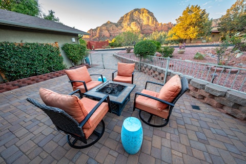 Toast the evening around the fire pit as Chimney Rock glows
