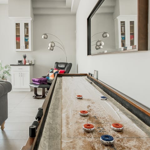 Play a game of shuffleboard