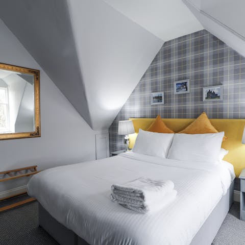 Enjoy a restful sleep in one of the serene bedrooms after a day exploring the Highlands