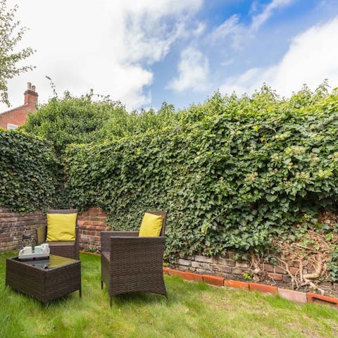 Enjoy a coffee or a glass of wine in the charming walled garden