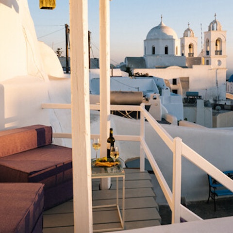 Enjoy a glass of wine on the terrace and admire the village views