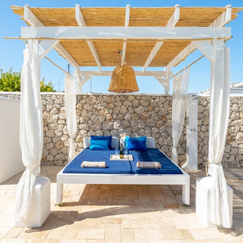 Read a good book or sip a cold white wine on the daybed