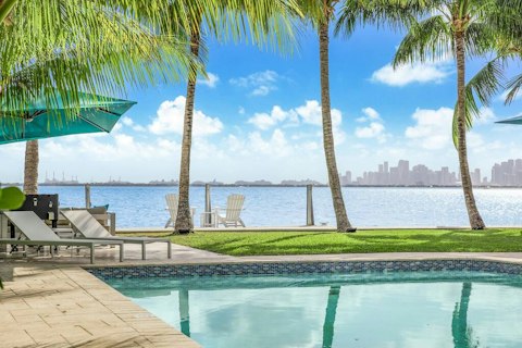 Swim in the pool with the Miami skyline stretching beyond the water