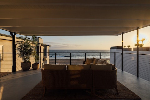 Watch the sun drop into the Pacific from the balcony
