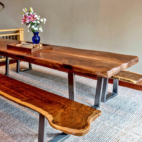 Dine around the custom walnut dining table