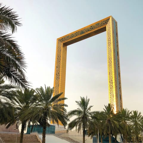 Capture that perfect shot under the iconic Dubai Frame, a short drive away
