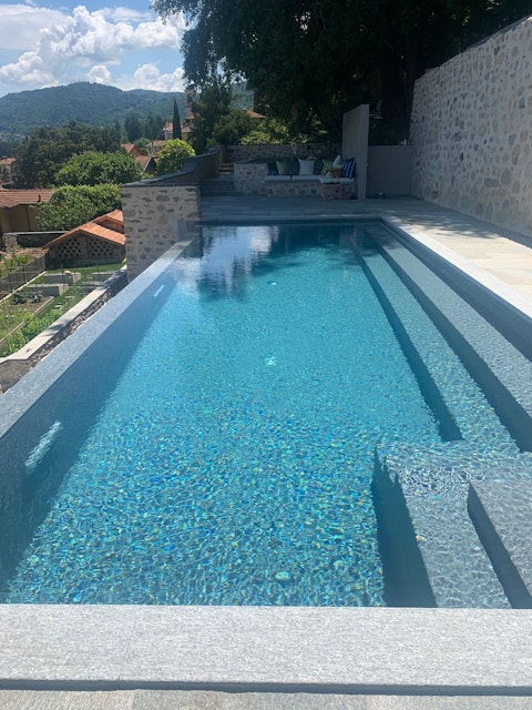 Swim lengths in the communal pool on a warm afternoon