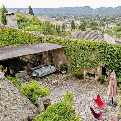 Dine alfresco in the shade of a cypress tree