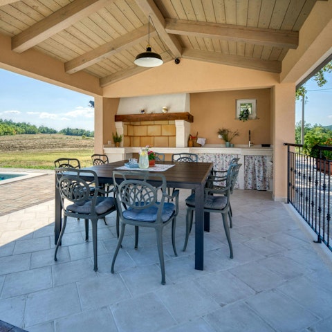Gather for meals on the terrace, complete with countryside views