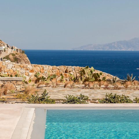 Step out onto the terrace and enjoy relaxing views from the pool