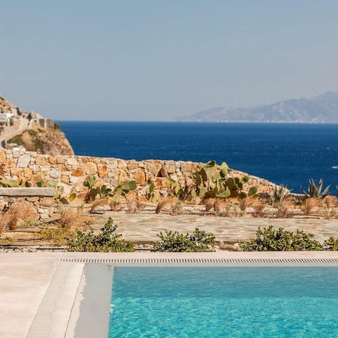 Step out onto the terrace and enjoy relaxing views from the pool