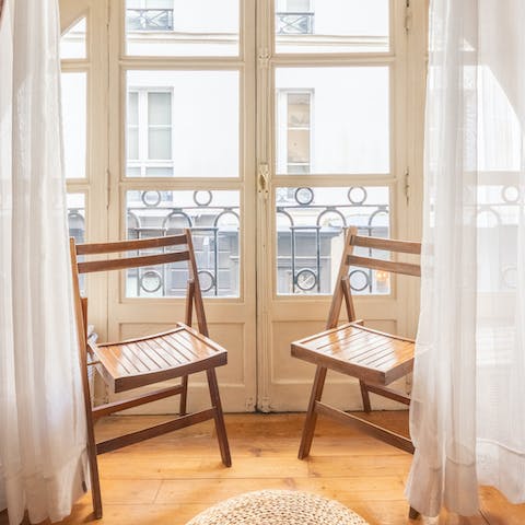 Throw open the French doors and watch the hustle and bustle on the street below
