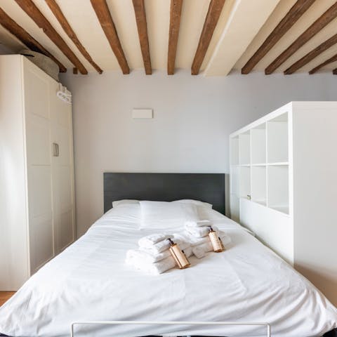 Rest weary feet in the comfortable bed after a long day exploring the City of Lights