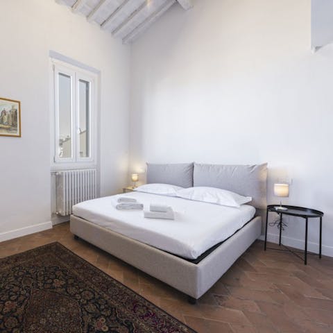 Sink into the comfortable bed after a busy day of sightseeing