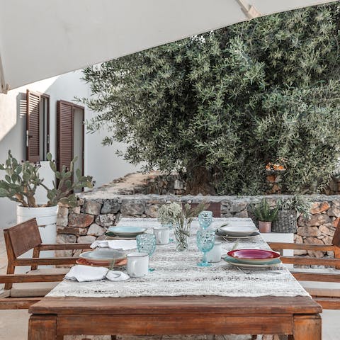 Dine alfresco in a shady spot, sharing delicious food with loved ones