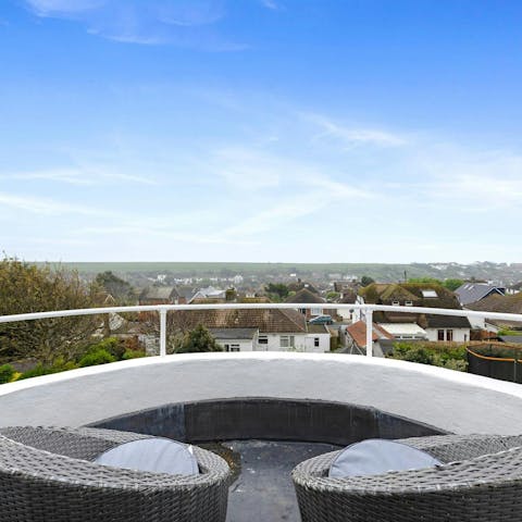 Enjoy a refreshing beverage on your private patio overlooking the rooftops
