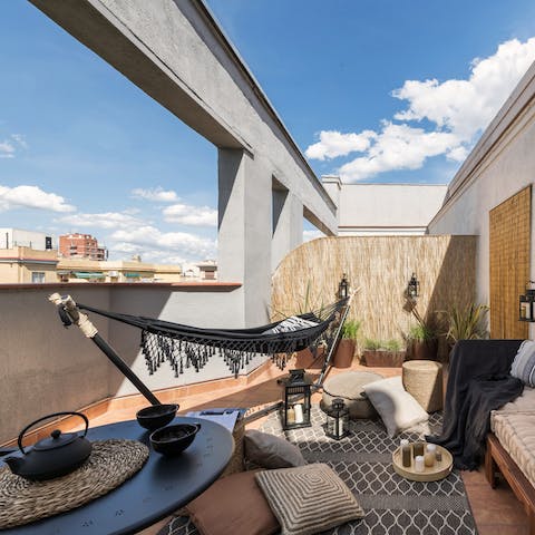 Lie up in the hammock on the sunny private terrace