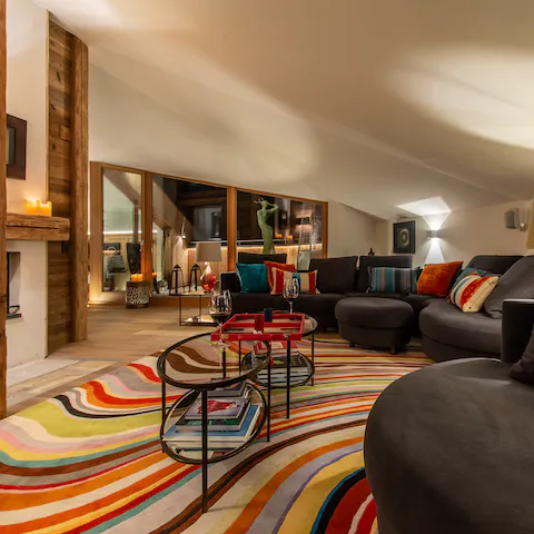 Gather around the wood-burning fireplace in the large living room