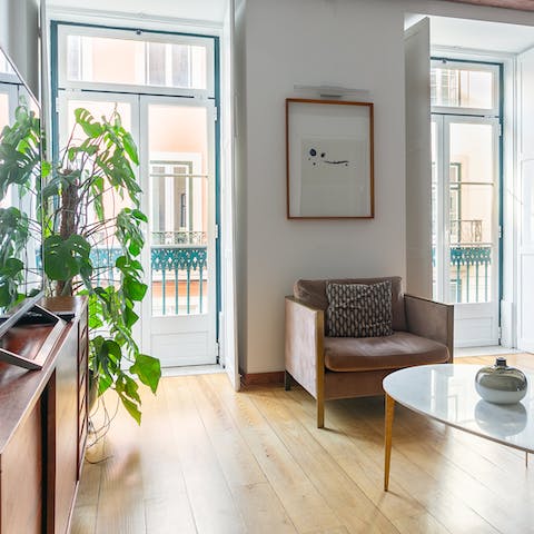 Open the double doors to the narrow balcony