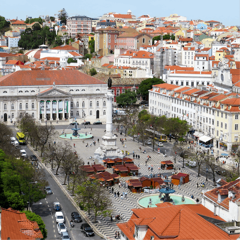Walk eight minutes to Praça do Rossio